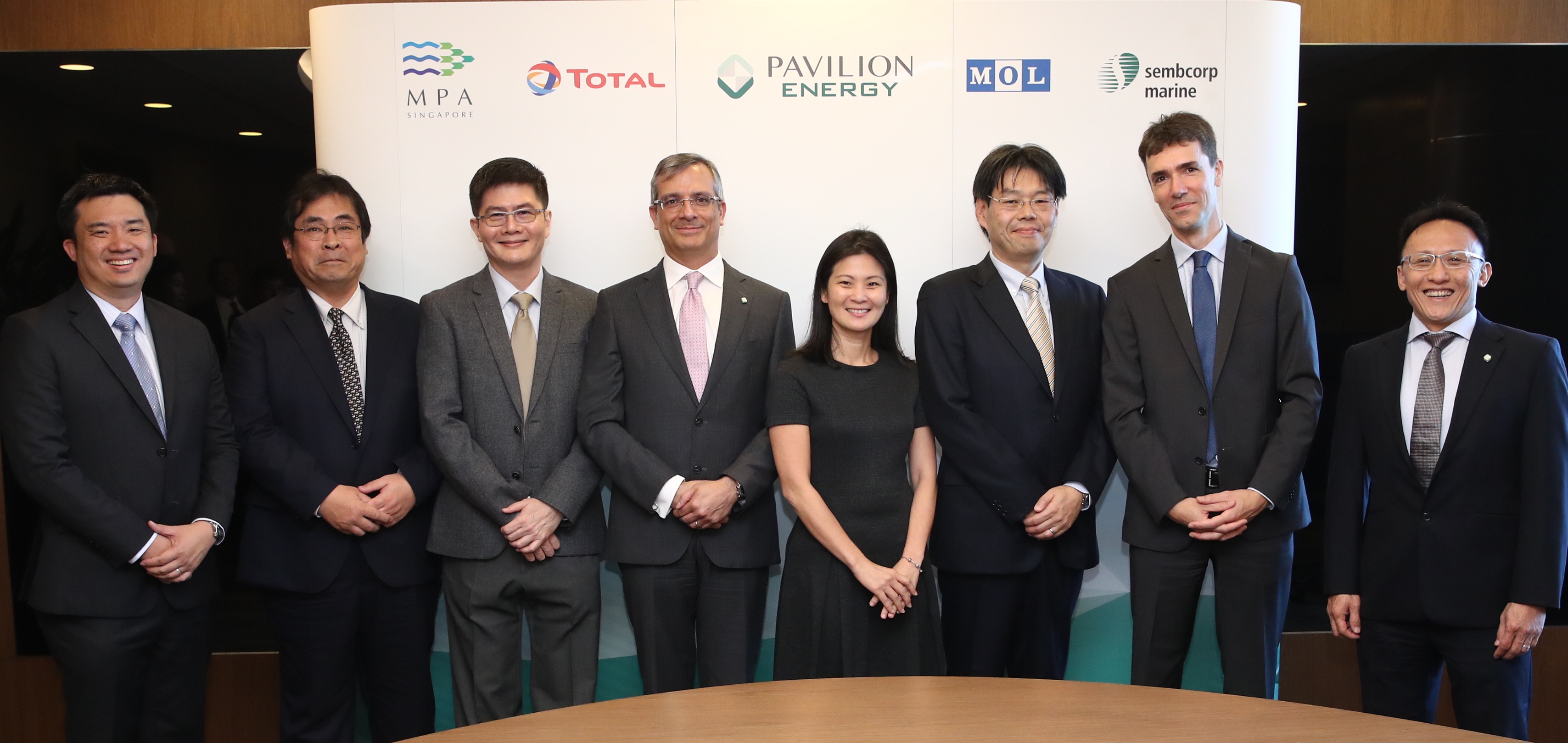 Above: "(from L to R) Mr Desmond Chong, GM of Sinanju; Mr Soichiro Kambe, Deputy GM of Mitsui; Mr Tan Heng Jack, Head of Specialised Shipbuilding of Sembcorp Marine; Mr Frédéric H. Barnaud, Group CEO of Pavilion Energy; Ms Quah Ley Hoon, Chief Executive of Maritime & Port Authority of Singapore; Mr Michihiko Nakano, GM of Bunker Business Office of MOL; Mr Jérôme Leprince-Ringuet, MD of Total Marine Fuels; and Mr Alan Heng, EVP of Pavilion Energy Singapore" Above: "(from L to R) Mr Desmond Chong, GM of Sinanju; Mr Soichiro Kambe, Deputy GM of Mitsui; Mr Tan Heng Jack, Head of Specialised Shipbuilding of Sembcorp Marine; Mr Frédéric H. Barnaud, Group CEO of Pavilion Energy; Ms Quah Ley Hoon, Chief Executive of Maritime & Port Authority of Singapore; Mr Michihiko Nakano, GM of Bunker Business Office of MOL; Mr Jérôme Leprince-Ringuet, MD of Total Marine Fuels; and Mr Alan Heng, EVP of Pavilion Energy Singapore"